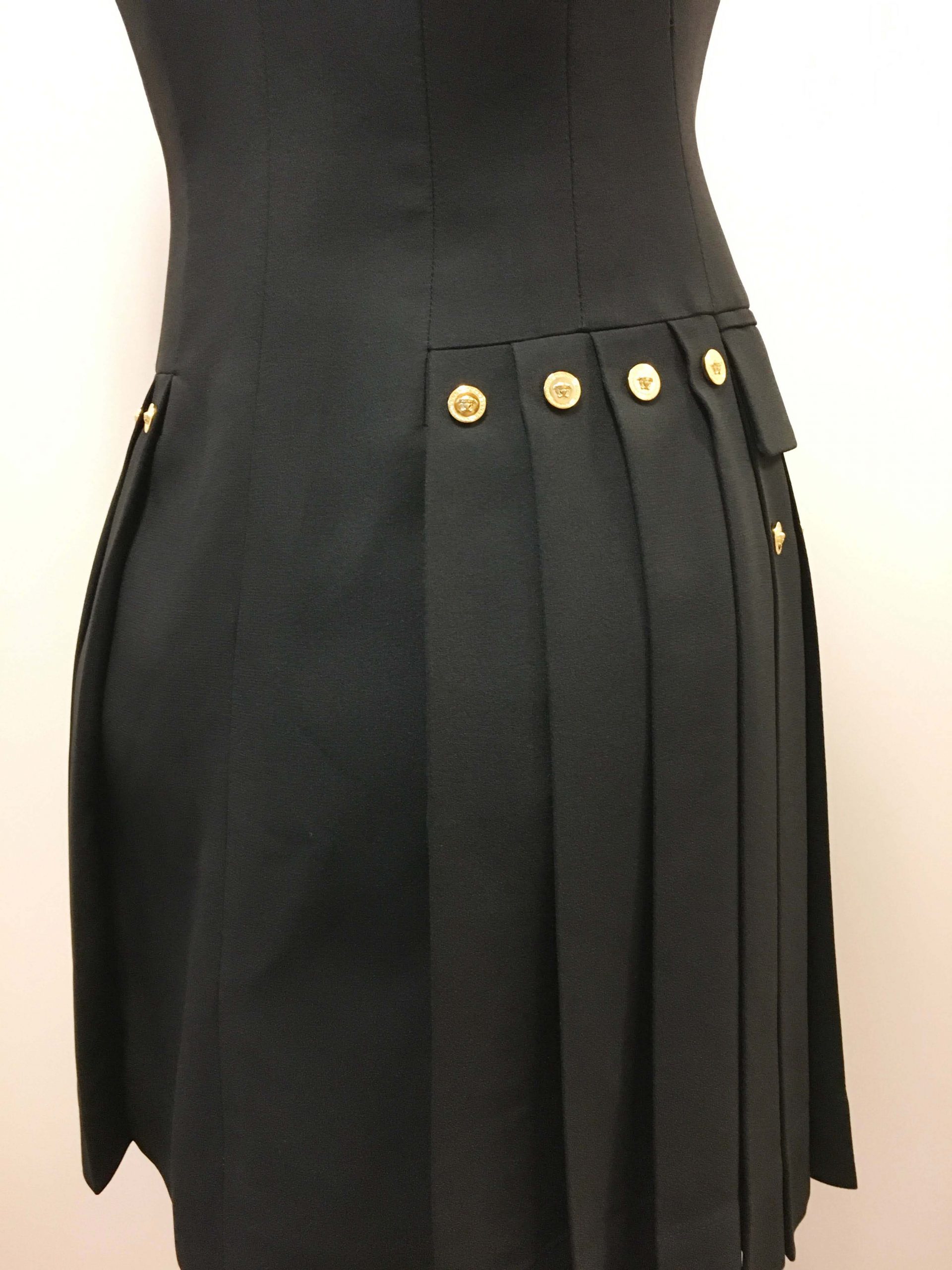 Double-Breatsed Tuxedo Dress Featuring Pleated Skirt with Gold Buttons