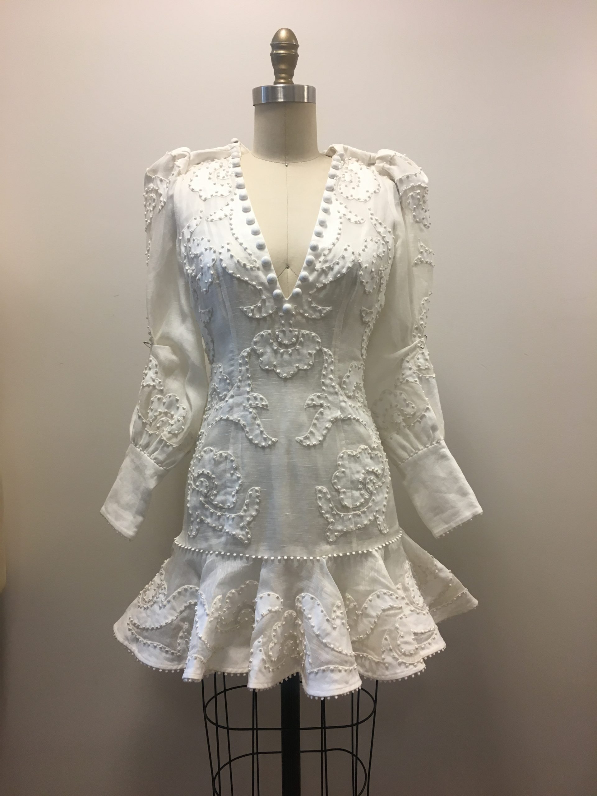 White Dress with Delicate Button Embroidery on the Yoke and Hem