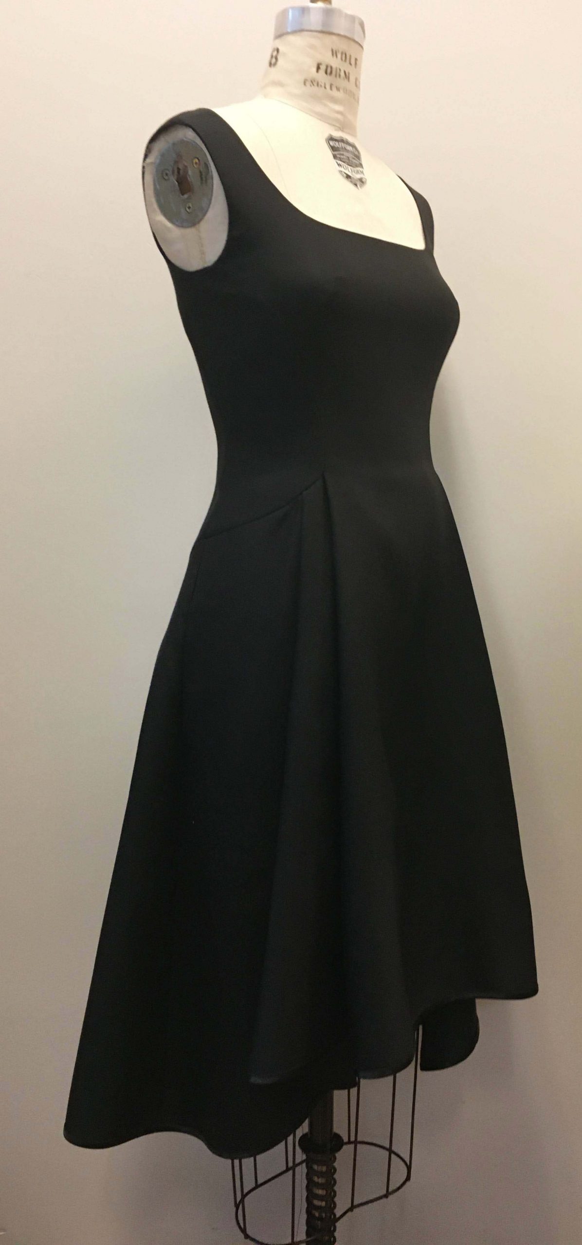 Black Dress with Sloped Pleating Along the Skirt Panel